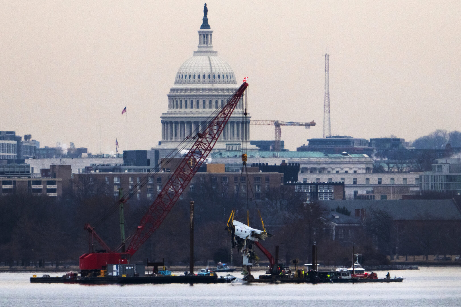 Wreckage from American Airlines Flight 5342 is pulled from the Potomac River near Ronald Reagan Washington National Airport on Feb. 3, 2025. The plane collided with a U.S. Army Black Hawk helicopter on Jan. 29, killing 67 people.