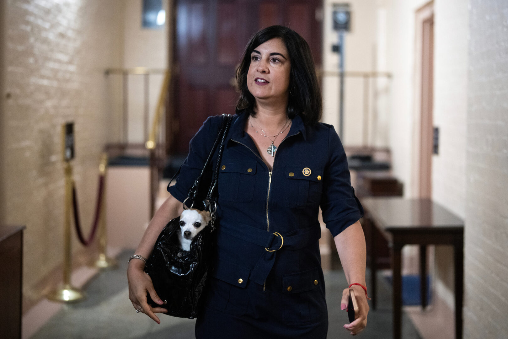 New York Rep. Nicole Malliotakis and her dog, Luna, leave a meeting of the House Republican Conference in the U.S. Capitol on June 4, 2025.