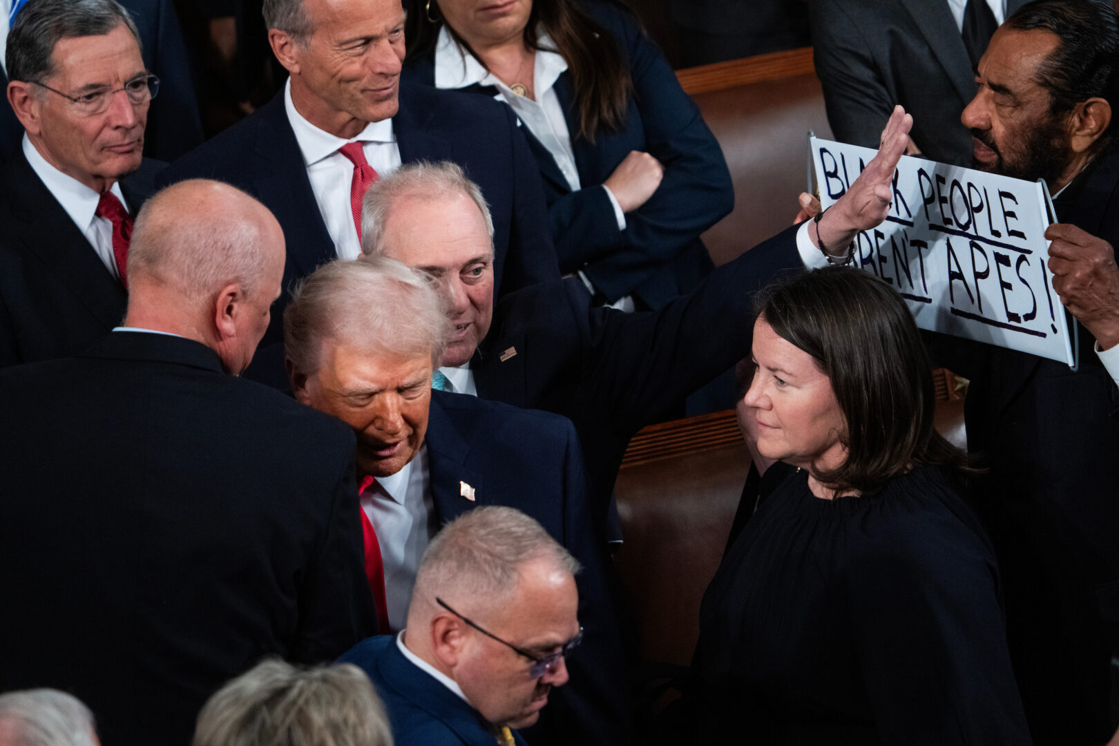  House Majority Leader Steve Scalise, R-La., blocks a sign held by Rep. Al Green, D-Texas, as President Donald Trump arrived for his State of the Union address in the House Chamber of the U.S. Capitol on Tuesday, Feb.24, 2026. 