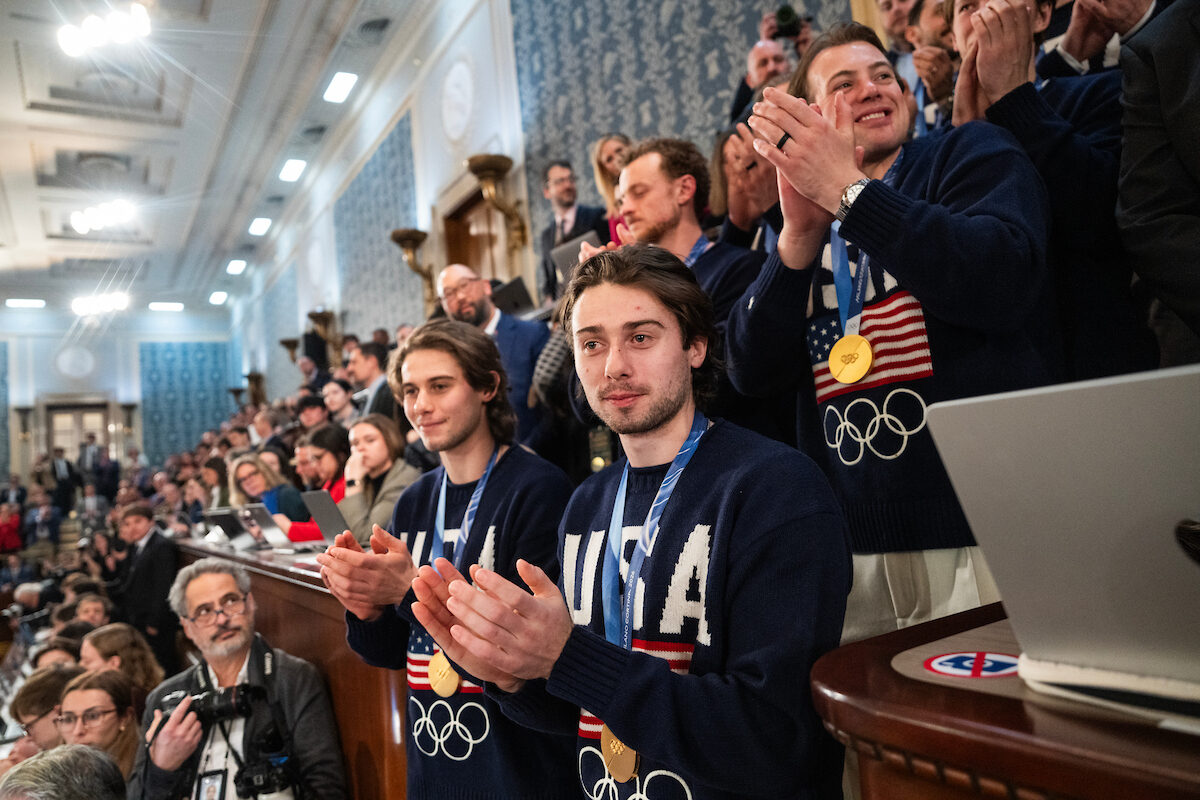 Team U.S.A. hockey gold medalists Quinn Hughes, right, his brother Jack Hughes, left, and their teammates are recognized by President Donald Trump during Tuesday's State of the Union address in the House Chamber.
