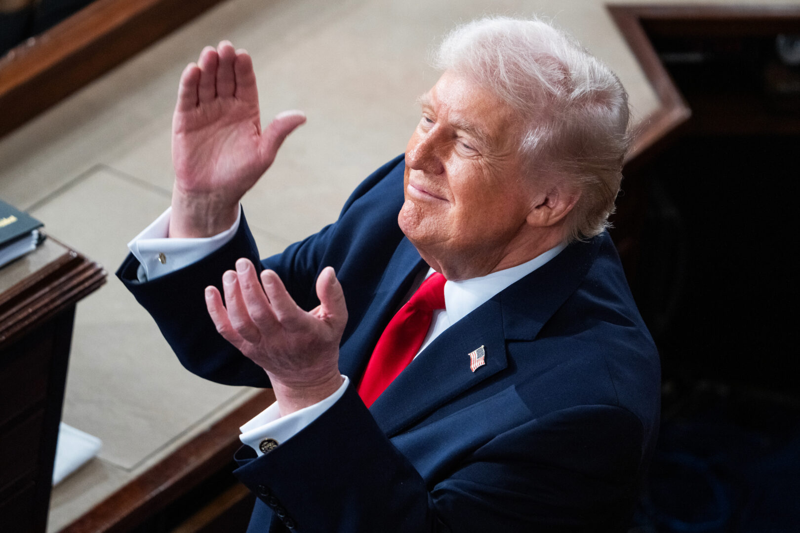 President Donald Trump applauds for a guest during his State of the Union address on Feb. 24. 