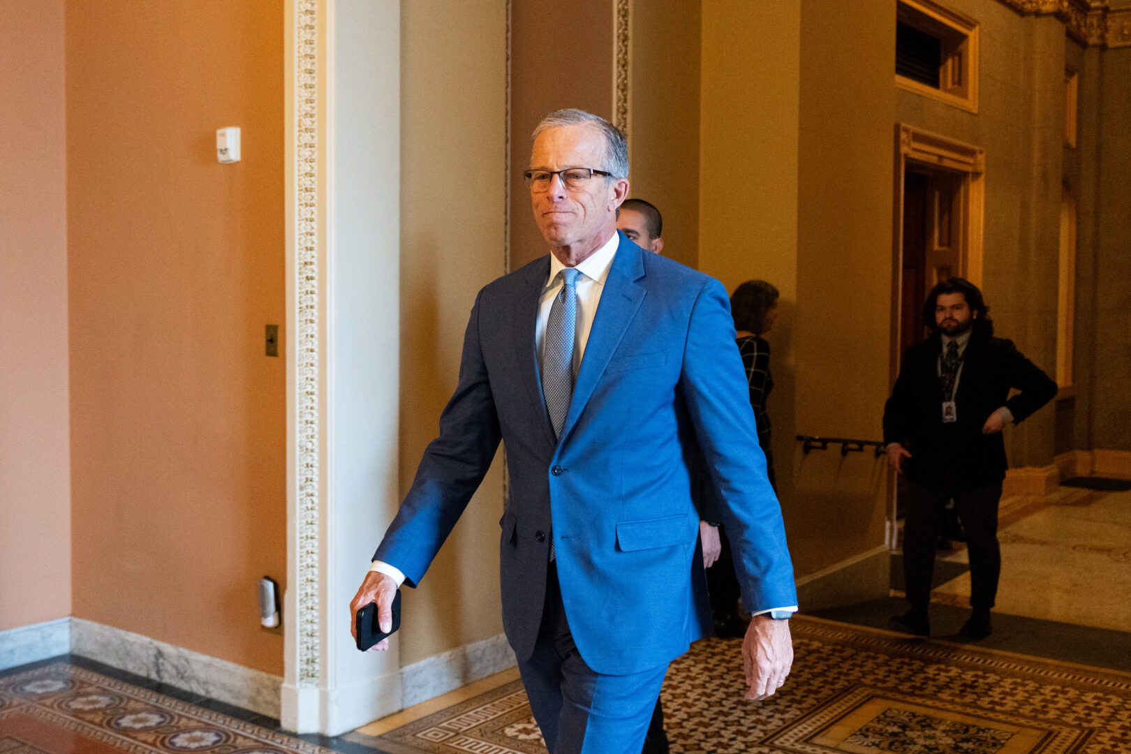 Senate Majority Leader John Thune, R-S.D., walks from his office to the Senate floor on Thursday.
