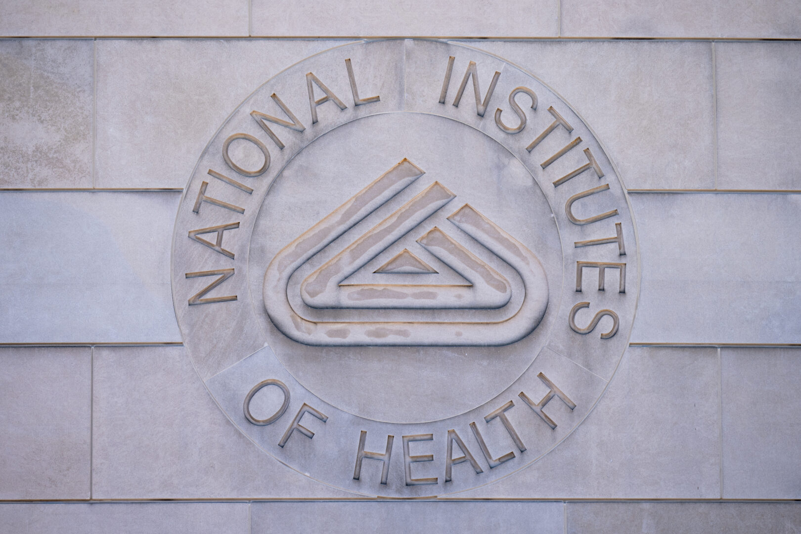 The National Institutes of Health logo at the agency's headquarters  in Bethesda, Md. (Bill Clark/CQ Roll Call file photo)