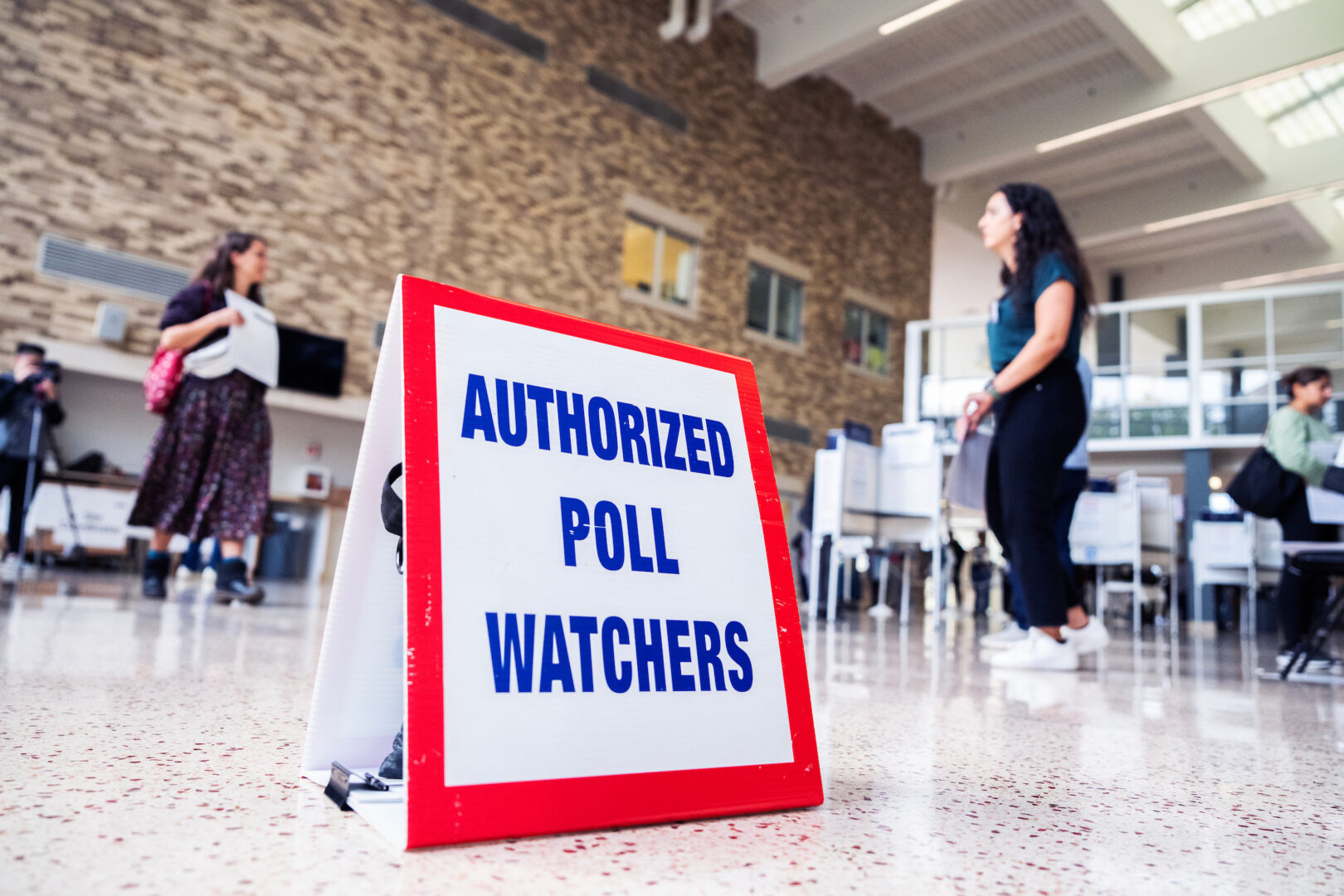 A poll watchers sign is seen at Dunbar High School on Election Day in  Washington. 