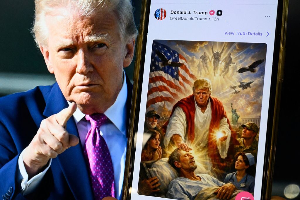 This photo illustration created on Monday shows a picture of President Donald Trump on a screen and an AI-generated picture he posted, then deleted, on his Truth Social platform, appearing to depict himself as Jesus Christ. (Mandel Ngan/AFP via Getty Images)