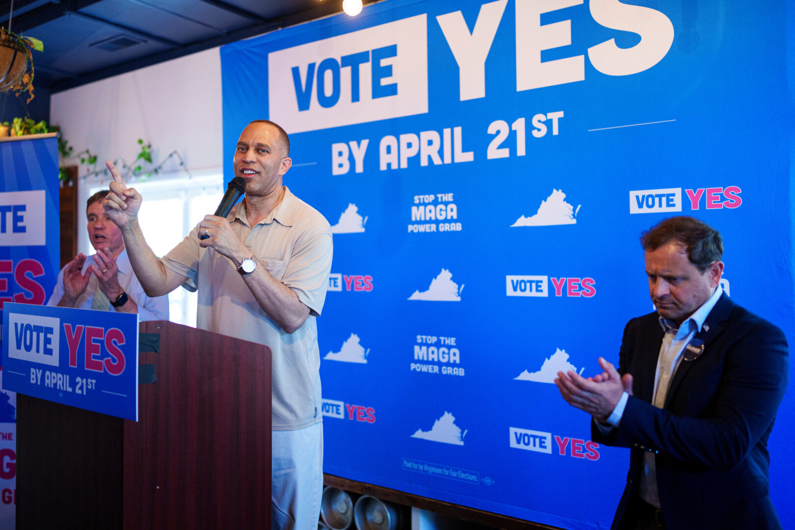 House Minority Leader Hakeem Jeffries, D-N.Y., flanked by Sen. Mark Warner, D-Va., left, and Congressional candidate Tom Perriello, D-Va., speaks at the Virginians for Fair Elections rally in Charlottesville on Saturday. Virginia voters will decide if Virginia congressional districts will be redrawn to counter redistricting in Texas and elsewhere.