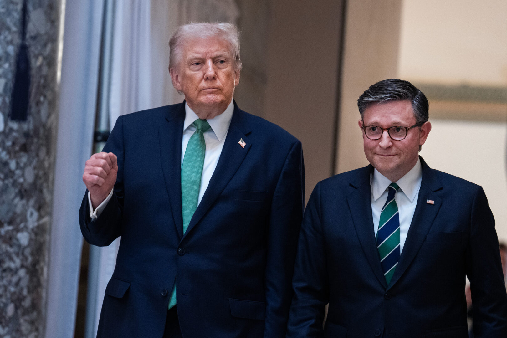 President Donald Trump and Speaker of the House Mike Johnson, R-La., are seen in the U.S. Capitol’s Statuary Hall after the Friends of Ireland luncheon with Micheál Martin, Taoiseach of Ireland, on St. Patrick's Day, Tuesday, March 17, 2026. 