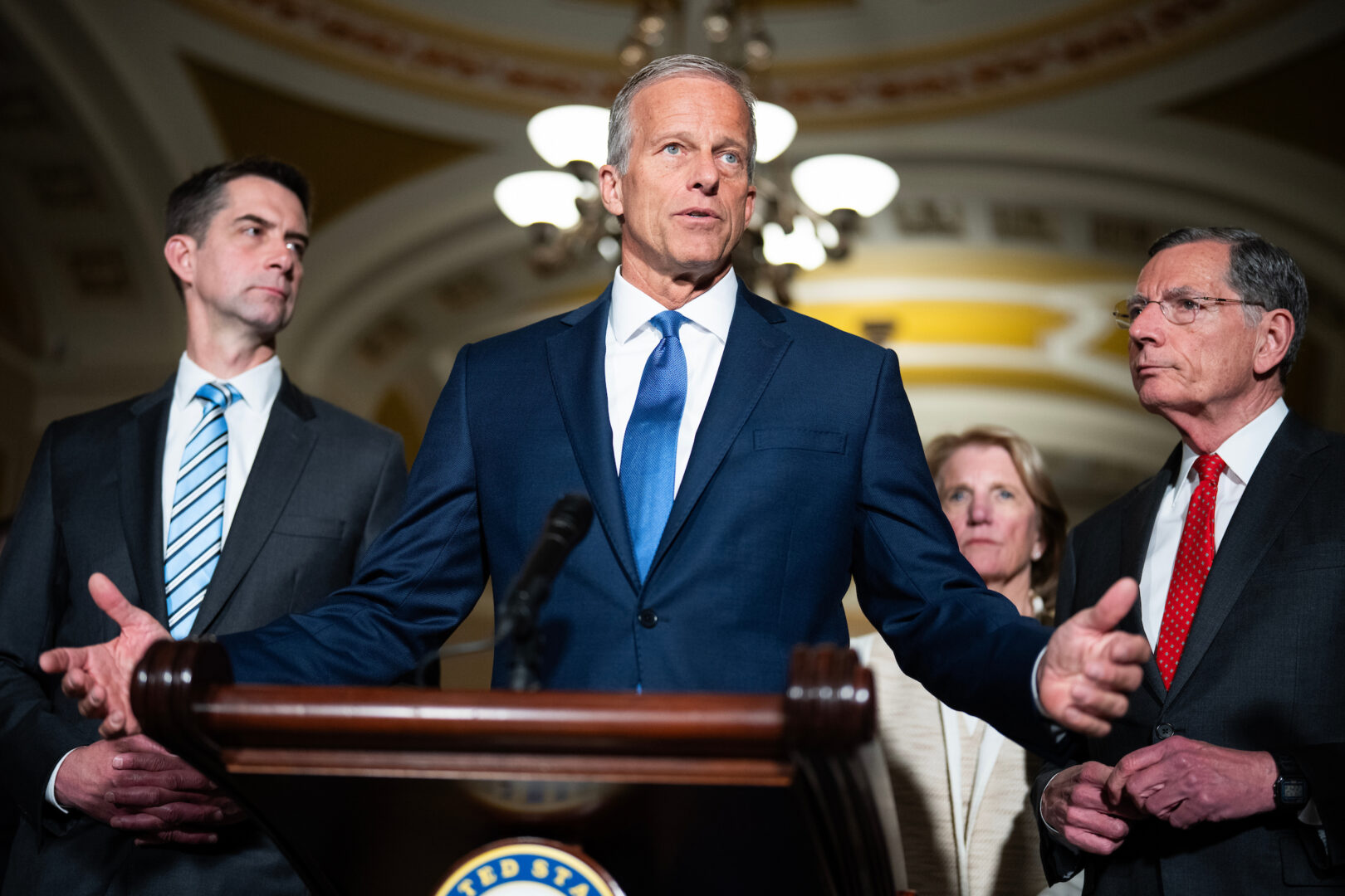 John Thune conducts a news conference at the Capitol in May, surrounded by his leadership lieutenants. As the midterms approach, the Senate majority leader is looking back on his first year and a half on the job.