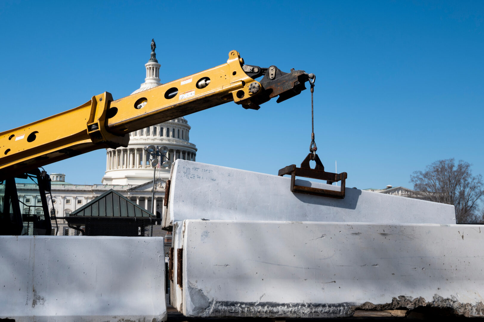 With narrow majorities, fewer deal-makers and power struggles with the president, paths once open to Congress are closing. Above, workers place concrete jersey barriers near the Capitol ahead of the State of the Union in 2022. 