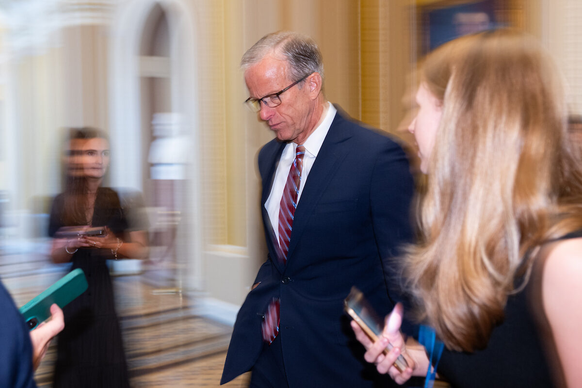 Senate Majority Leader John Thune speaks to reporters as he leaves the Senate floor on July 14. (Bill Clark/CQ Roll Call)