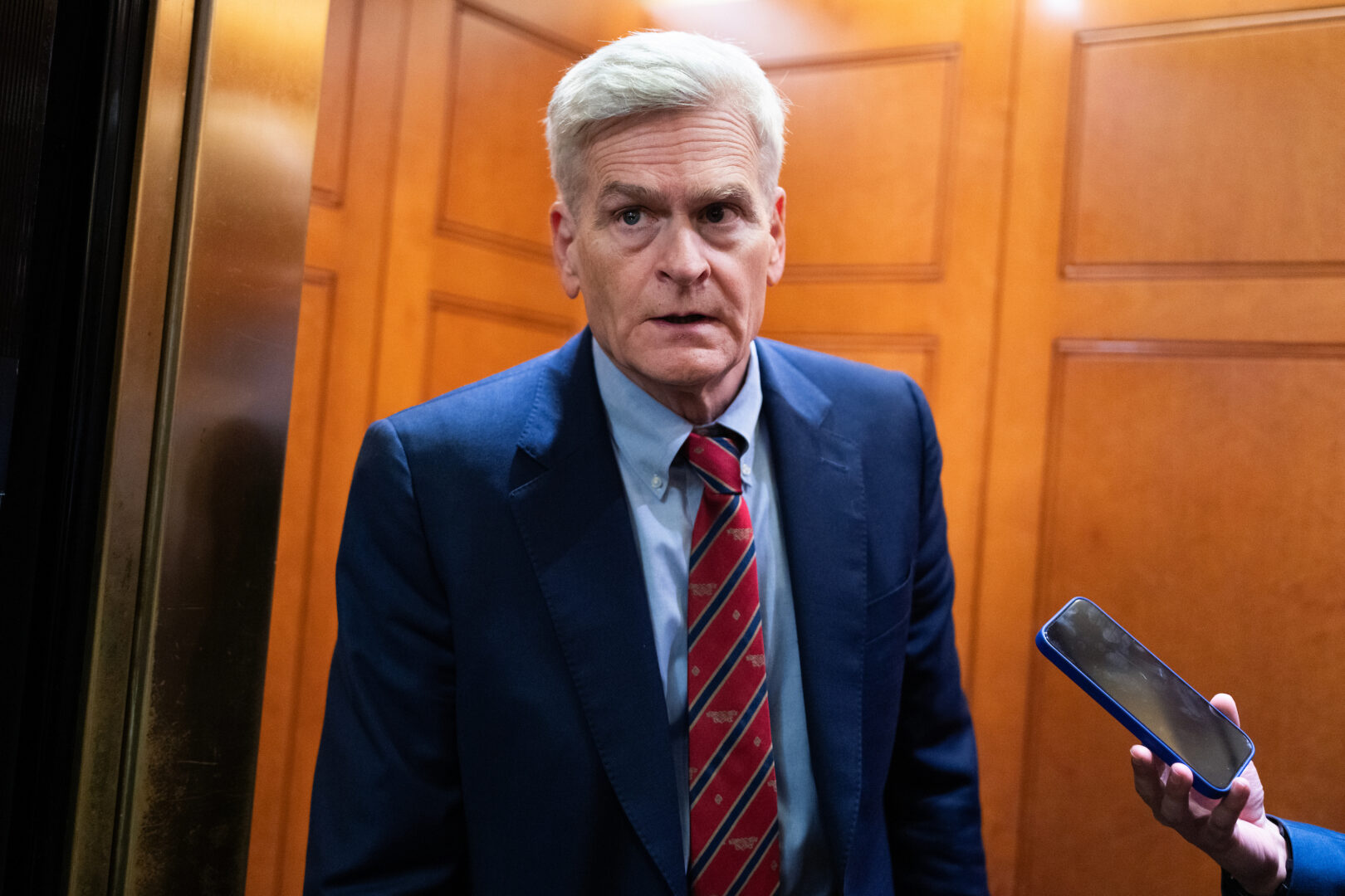 Sen. Bill Cassidy, R-La., talks with reporters in the Capitol on Wednesday. 
