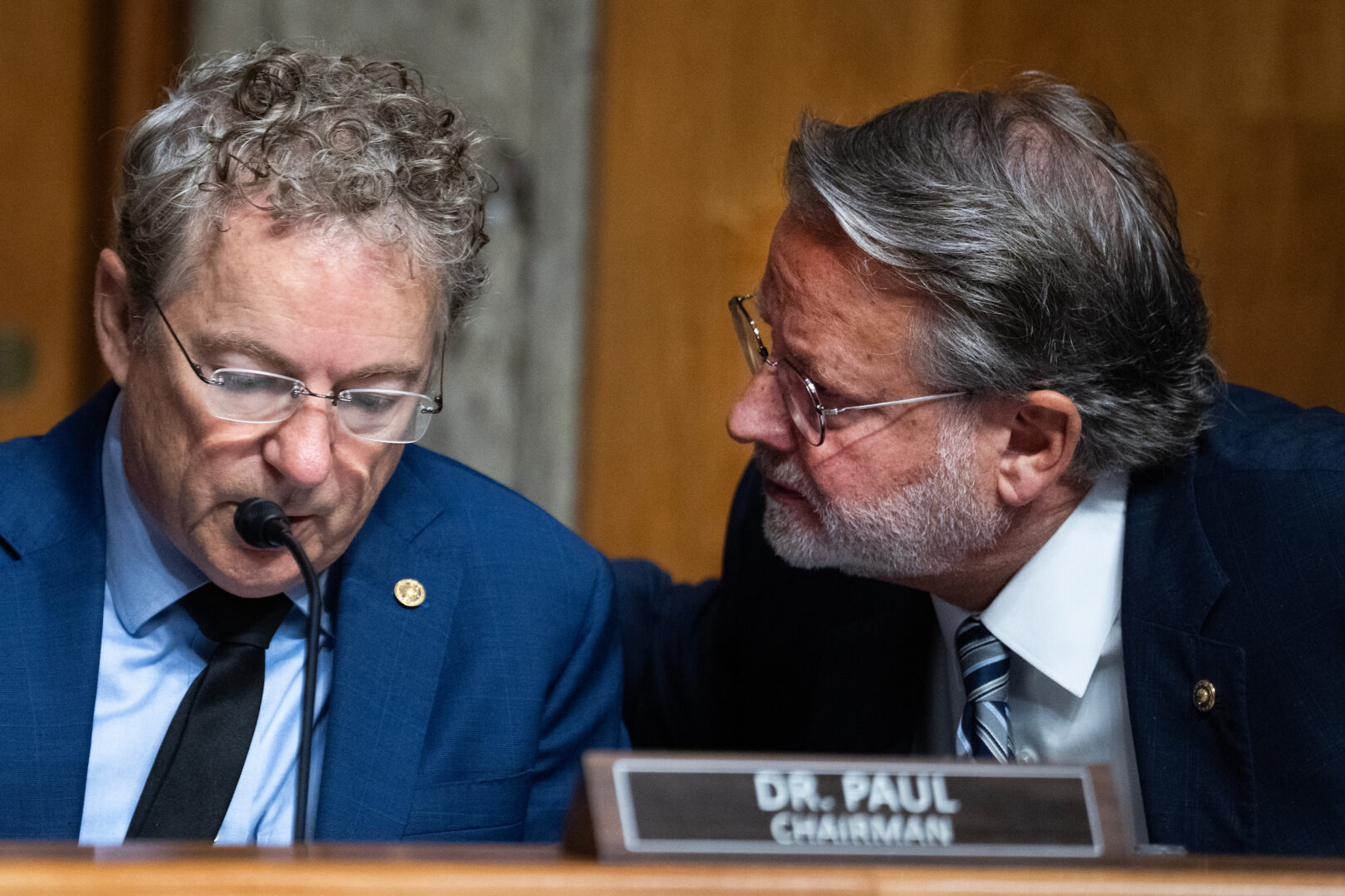 Chairman Rand Paul, R-Ky., left, and ranking member Gary Peters, D-Mich., conduct a Senate Homeland Security and Governmental Affairs Committee business meeting on Aug. 6. 